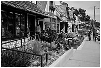 Shops and couple walking, Cambria. California, USA ( black and white)