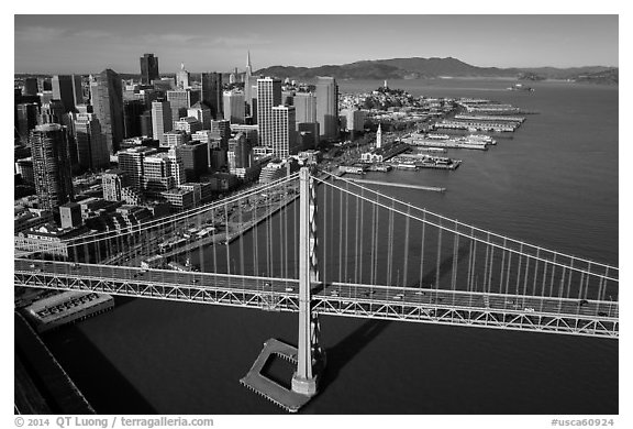 Aerial view of Bay Bridge, downtown, and piers. San Francisco, California, USA (black and white)