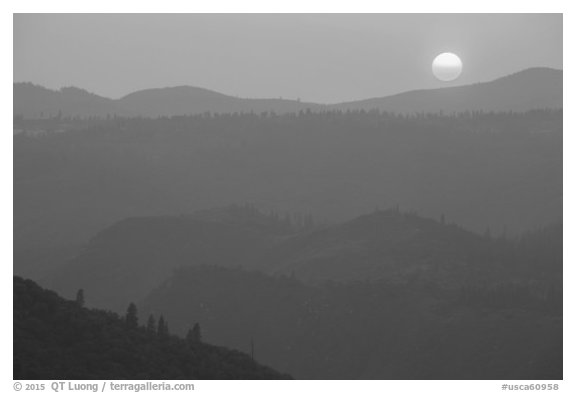 Setting sun and mountain ridges, Stanislaus National Forest. California, USA (black and white)