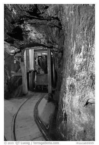Gallery with tracks and ore car, Gold Bug Mine, Placerville. California, USA (black and white)