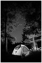 Tent and campfire at night,  Prosser Ranch Group Campground, Tahoe National Forest. California, USA ( black and white)