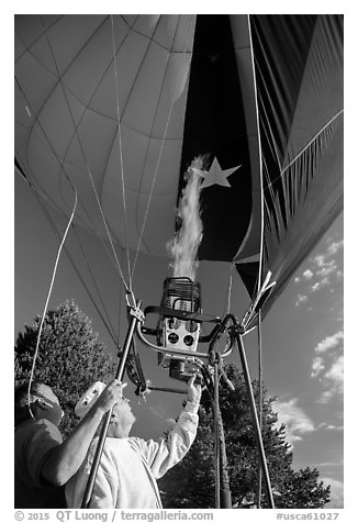Pilot releases hot air into balloon, Tahoe National Forest. California, USA (black and white)