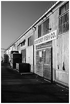 Monterey Fish Company buildings on wharf. Monterey, California, USA ( black and white)
