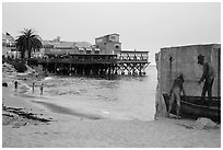Beach near Cannery Row on cloudy day. Monterey, California, USA ( black and white)