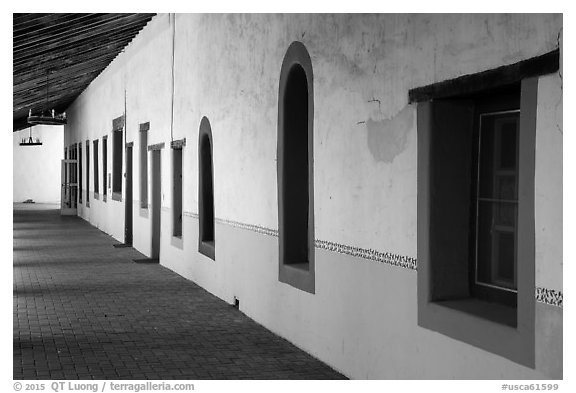 Brightly colored windows, inside arcade, Mission San Miguel. California, USA (black and white)