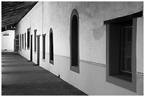 Brightly colored windows, inside arcade, Mission San Miguel. California, USA ( black and white)