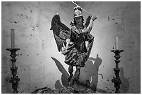 Statue of archangel San Miguel slaying dragon. California, USA ( black and white)