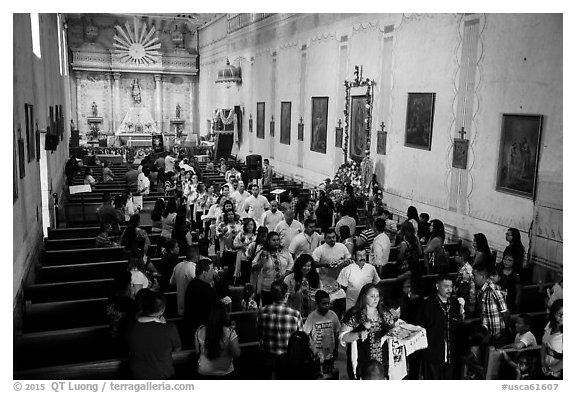 Festival procession in Mission San Miguel church. California, USA (black and white)