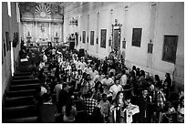 Festival procession in Mission San Miguel church. California, USA ( black and white)