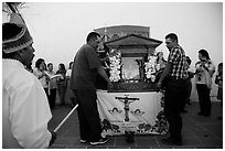 Men carrying Senor de los Milagros altar, Mission San Miguel. California, USA ( black and white)
