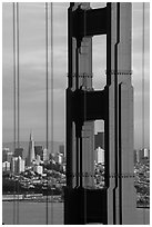 Golden Gate Bridge pillar and city skyline. San Francisco, California, USA ( black and white)