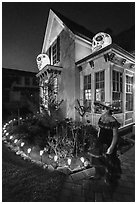 Woman in Halloween costume and decorated house. Petaluma, California, USA ( black and white)