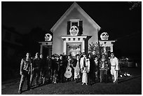 Halloween revelers and decorated house. Petaluma, California, USA ( black and white)