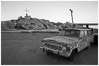 Painted car and Salvation Mountain. Nyland, California, USA ( black and white)