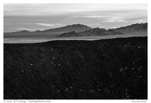 Amboy Crater rim and mountains. Mojave Trails National Monument, California, USA (black and white)