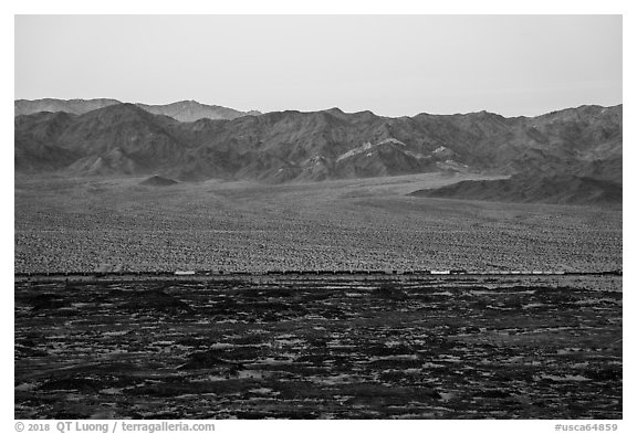 Freigh train and desert mountains. Mojave Trails National Monument, California, USA (black and white)