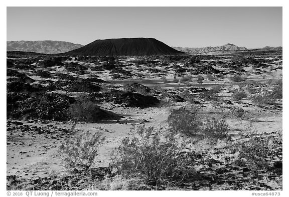 Volcanic terrain with Amboy Crater extinct cinder cone volcano. Mojave Trails National Monument, California, USA (black and white)