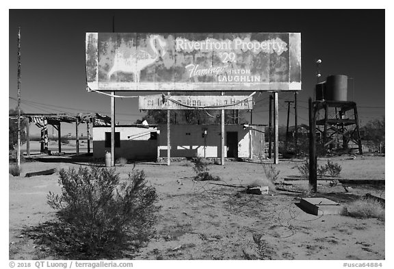 Old billboard and abandonned gas station. Mojave Trails National Monument, California, USA (black and white)