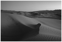 Cadiz Wilderness Sand Dunes and Shiphole Mountains at dusk. Mojave Trails National Monument, California, USA ( black and white)