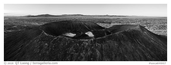Aerial panoramic view of Amboy Crater and Bullion Mountains at sunrise. Mojave Trails National Monument, California, USA (black and white)