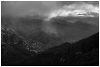 Rolling peaks under storm sky with shaft of light. San Gabriel Mountains National Monument, California, USA ( black and white)