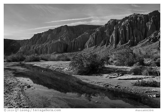 Afton Canyon cliffs reflected in shallow Mojave River. Mojave Trails National Monument, California, USA (black and white)