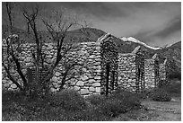 Ruined stone cabins and San Giorgono Mountain. Sand to Snow National Monument, California, USA ( black and white)