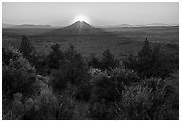 Whitney Butte with sun setting. Lava Beds National Monument, California, USA ( black and white)