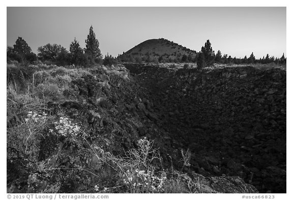 Lava depression and Schonchin Butte, dawn. Lava Beds National Monument, California, USA (black and white)