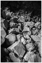 Colored rocks from collapsed ceilling, Big Painted Cave. Lava Beds National Monument, California, USA ( black and white)