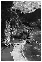 McWay waterfall flowing on beach, Julia Pfeiffer Burns State Park. Big Sur, California, USA ( black and white)
