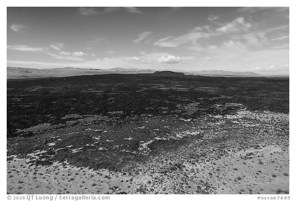 Aerial view of Lavic Lake volcanic field with distant Pisgah Crater. Mojave Trails National Monument, California, USA (black and white)