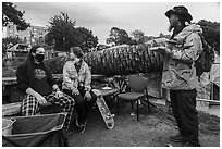 Volunteers and Peoples Park resident eating meal. Berkeley, California, USA ( black and white)