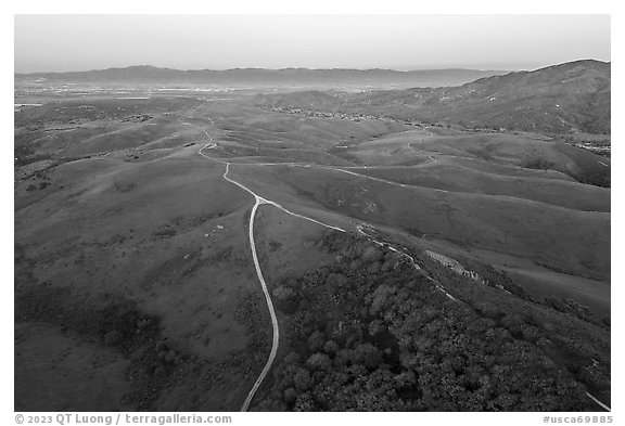 Aerial view of roads, gently rolling hills, with Salinas Valley in the distance. California, USA (black and white)