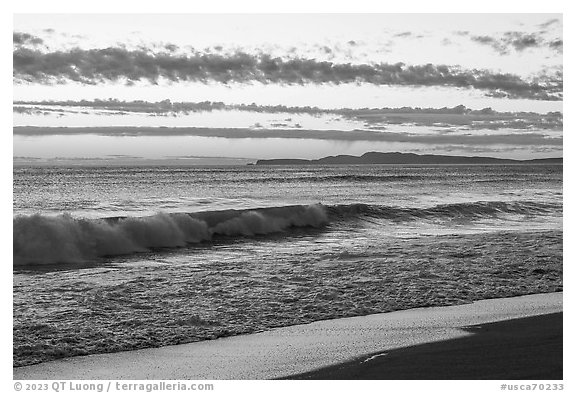Surf and distant Point Reyes at sunset. Point Reyes National Seashore, California, USA (black and white)