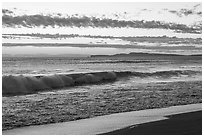 Surf and distant Point Reyes at sunset. Point Reyes National Seashore, California, USA ( black and white)