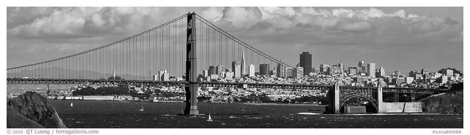 Golden Gate Bridge, and San Francisco city skyline with cloudy sky. San Francisco, California, USA (black and white)