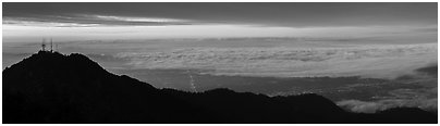 Los Angeles Basin covered with sea of clouds from Mount Wilson, sunrise. San Gabriel Mountains National Monument, California, USA (Panoramic black and white)