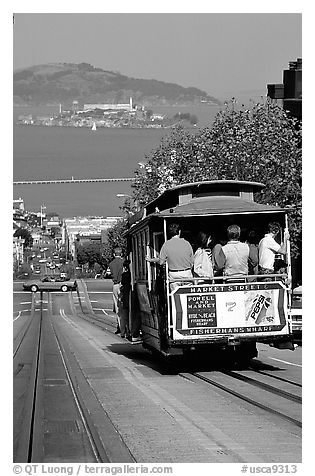 Cable car on Hyde Street, with Alcatraz Island in the background. San Francisco, California, USA (black and white)