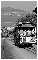 Cable car on Hyde Street, with Alcatraz Island in the background. San Francisco, California, USA (black and white)