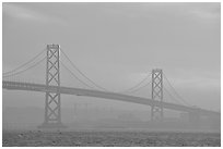 Bay Bridge seen from Treasure Island, sunset. San Francisco, California, USA (black and white)