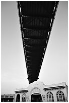 Bay Bridge dwarfs Pier 26 building. San Francisco, California, USA (black and white)