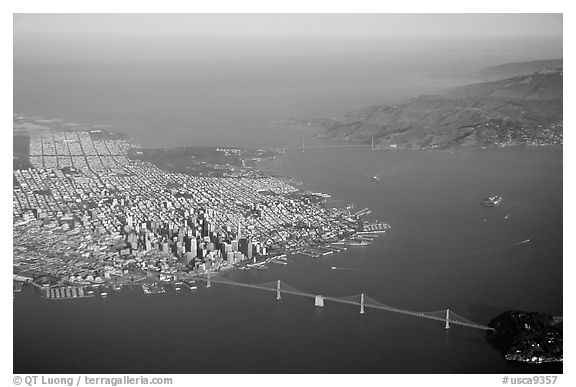 Aerial view of the Bay Bridge, the city, and  the Golden Gate Bridge. San Francisco, California, USA