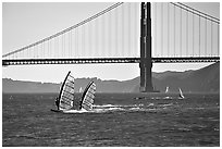 Windsurfers at Crissy Field, with the Golden Gate Bridge behind. San Francisco, California, USA (black and white)