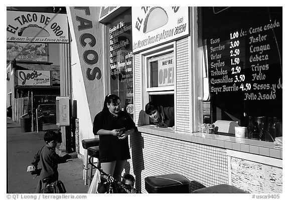 Hispanic women at a taco shop. Redwood City,  California, USA (black and white)