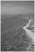 Hiker on trail at the summit of Mission Peak, Mission Peak Regional Park. California, USA ( black and white)