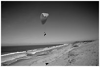 Paragliders soaring above Marina sand dunes. California, USA ( black and white)