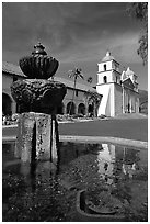 Fountain and Mission Santa Babara, mid-day. Santa Barbara, California, USA ( black and white)