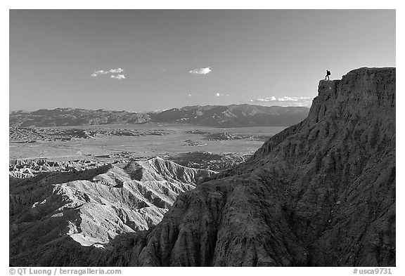 Visitor surveying panorama at Font Point. Anza Borrego Desert State Park, California, USA (black and white)