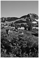 Hiker on trail towards Round Top, late afternoon. Mokelumne Wilderness, Eldorado National Forest, California, USA (black and white)
